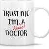 Trust Me I'm Almost a Doctor Funny Coffee Mug, Medical Student Gift for Medics Nurses Doctors, Graduation Birthday Gift for Friends Coworkers Trust Me I'm Almost a Doctor Funny Coffee Mug, Medical Student Gift for Medics Nurses Doctors, Graduation Birthday Gift for Friends Coworkers